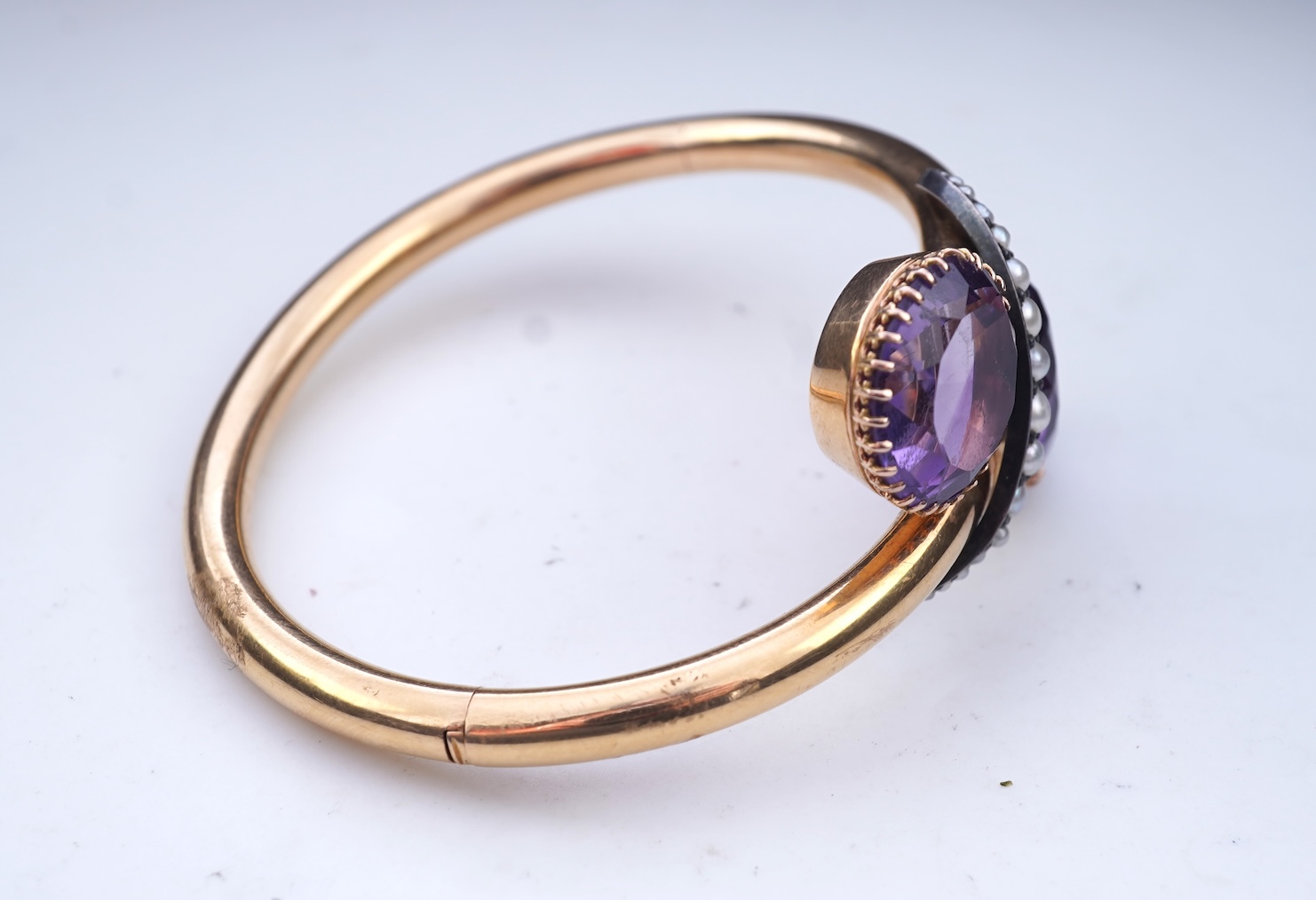 A Victorian gold, pearl and amethyst bangle, late 19th century